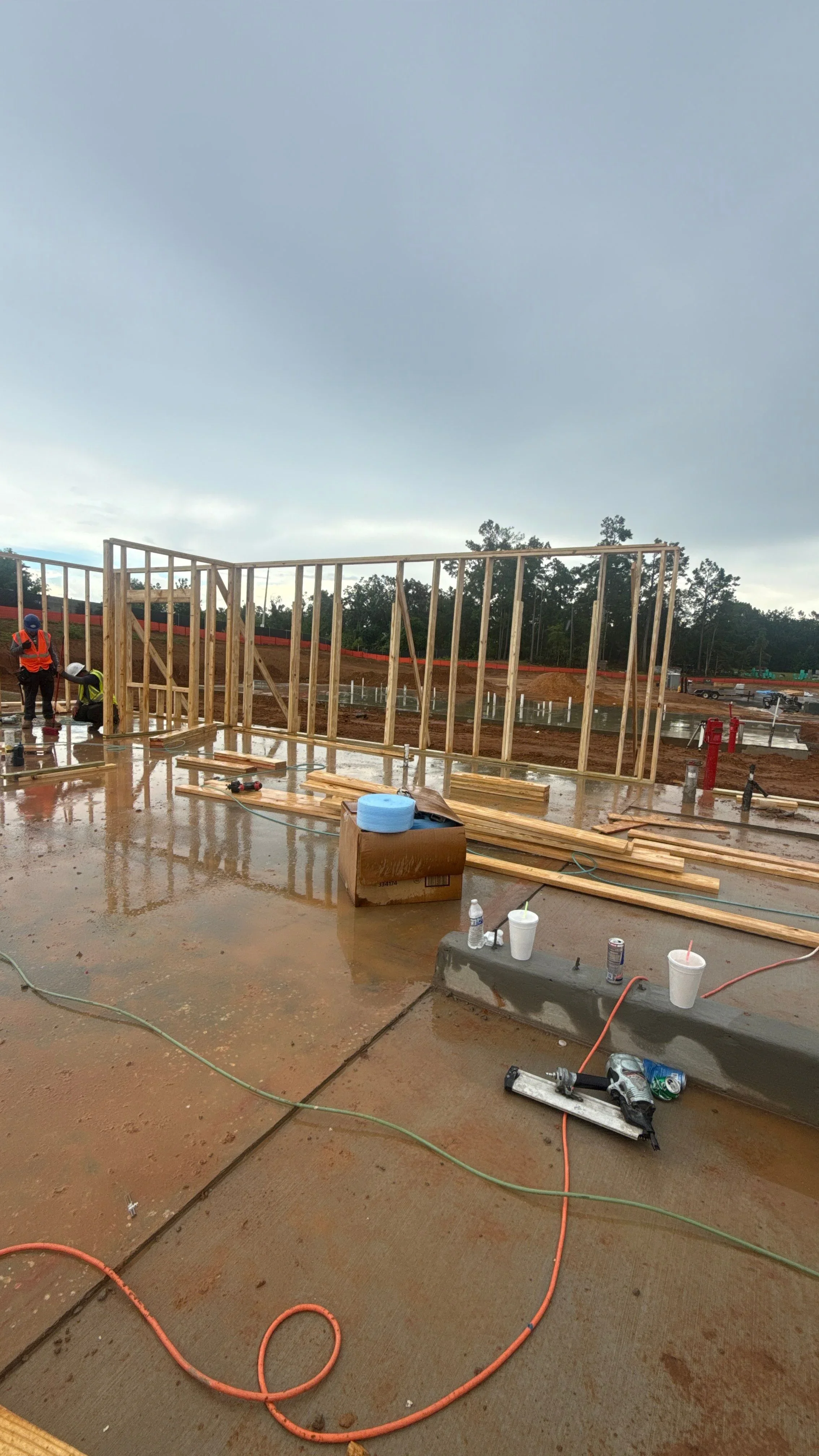 Wood-framed residential structure on concrete foundation with dimensional lumber framing